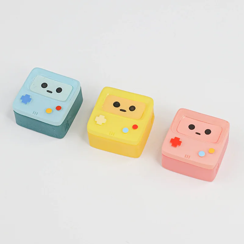 A handcrafted BMO ESC keycap, vibrant and translucent, featuring the iconic BMO character. This playful, retro-futuristic keyboard accent adds unique setup.