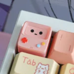 Whimsical BMO ESC keycap, iconic translucent design, vibrant hues, handcrafted quality. A playful, retro-futuristic keyboard accent for unique adventure time tribute.
