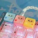 A charming, translucent BMO ESC keycap showcasing its iconic design and handcrafted quality. This whimsical accent brings a retro-futuristic animated design.