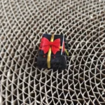 Exquisite handcrafted resin gift keycap, featuring a translucent miniature gift box with a delicate bowknot, designed as a custom ESC key.