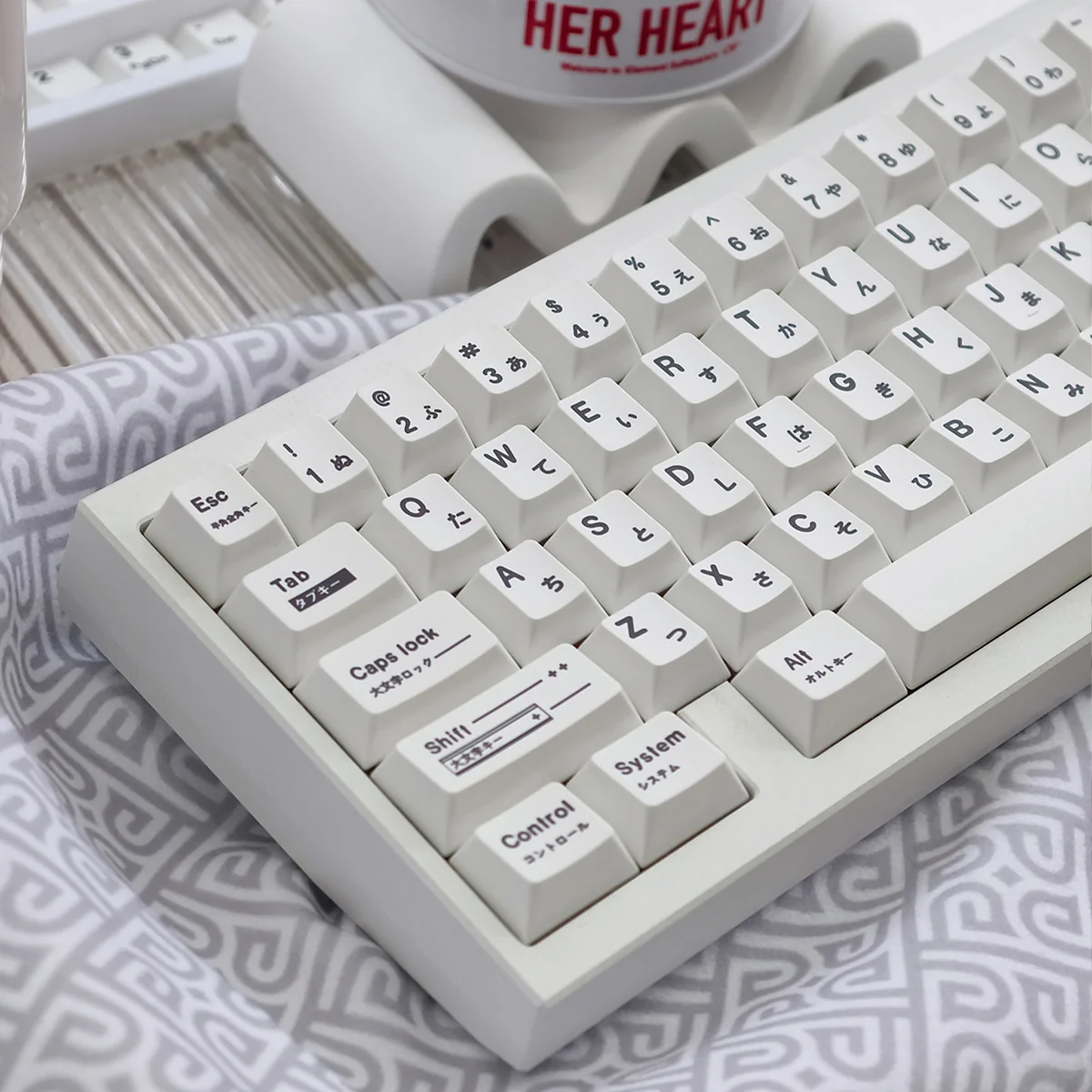 Close-up views of Braun PBT keycaps set, emphasizing the unique irregular white texture and minimalist design, a subtle homage to vintage Braun elegance.