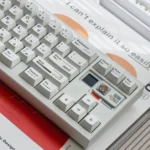 Braun PBT Keycaps Set gallery: Irregular White Minimalist Set. Unique textured keycaps from various angles, reflecting premium vintage Braun elegance.