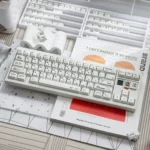 Unique Braun PBT Keycaps set featuring a subtle, textured irregular white finish. A premium minimalist design inspired by vintage Braun aesthetics.