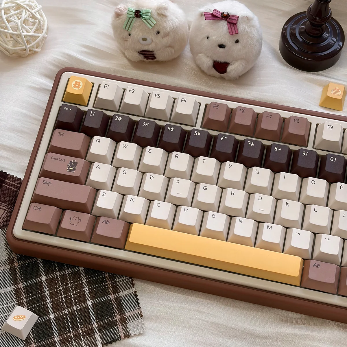 Close-up of the adorable Butter Bear PBT keycap set, showcasing its charming bear illustrations and warm buttery hues playfully.
