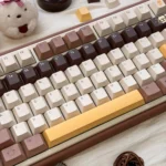 Playful Butter Bear PBT keycap set, showcasing adorable bear illustrations and a warm, buttery color scheme from a different angle.