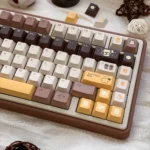 A delightful close-up of the Whimsical Butter Bear PBT Keycap Set, featuring charming bear illustrations and warm, buttery hues keycap design.