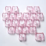 Close-up of a glowing butterfly heart keycap set, made from translucent PC, highlighting its whimsical design and vibrant glow for a playful keyboard set.