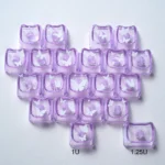 Playful glowing butterfly heart keycaps set, translucent PC, displayed from a charming angle, emphasizing their whimsical design and vibrant backlighting design.