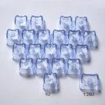 Gallery view of playful glowing butterfly heart keycaps set. Translucent PC showcases whimsical designs and vibrant backlighting from various angles.