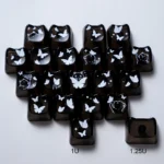 Playful MAO cat-shaped keycaps set featuring white glowing butterfly heart designs on translucent black PC, perfect for a whimsical keyboard setup.