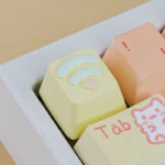 Close-up of a whimsical candy puppy heart signal ESC keycap, meticulously handcrafted from vibrant resin, revealing its unique artistic details and playful design.