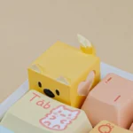 Handcrafted whimsical candy puppy resin ESC keycap, captured from a playful angle. Features vibrant colors and unique, meticulous details.