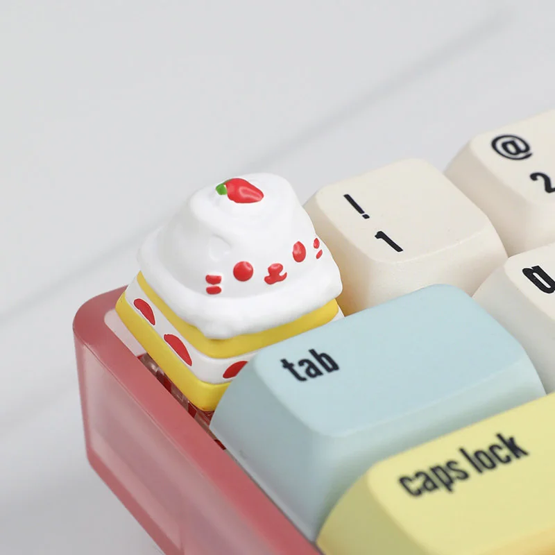 Close-up views of the exquisite handcrafted resin cat cake keycap, highlighting its adorable feline and vibrant dessert layers from various playful design.