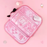 A playful close-up of the whimsical cat claw machine Desk Mat, showcasing vibrant colors and charming cat illustrations for an arcade-inspired desk mat.