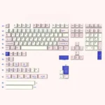 Close-up of adorable PBT cat keycaps set from a Japanese-inspired set, showcasing the crisp dye-sublimated feline illustrations and soft pastel tones.