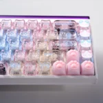 Detailed view of the adorable translucent PC cat keycaps set, highlighting the charming lazy cat designs and extra playful paw keycaps from multiple angle.