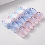 Close-up view of whimsical lazy cat translucent PC keycaps set, showcasing adorable cat motifs and playful bonus paw keycaps from various angles.