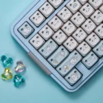Playful Cat Paradise MAO PBT translucent cat keycap set. Charming cat motifs with unique translucent cat ears and vibrant colors are shown.