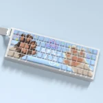Close-up of the playful cat paw PBT dye-sub keycap set, showcasing various adorable pastel keycaps from different angles for a whimsical keyboard.