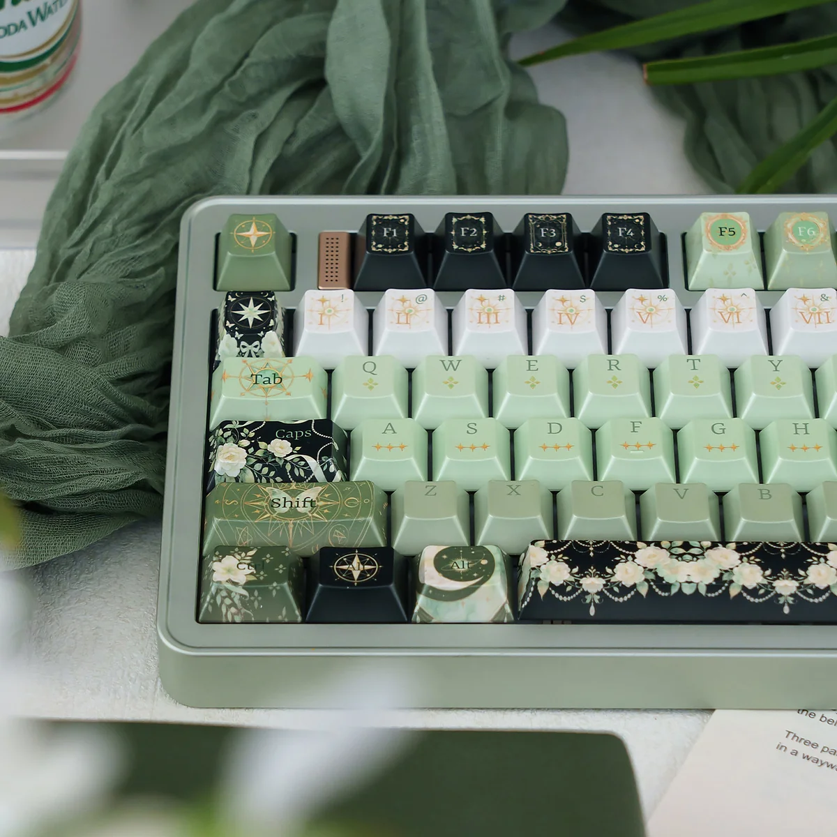 Close-up of an enchanting celestial artisan keycap, revealing its deep green cosmic hues, shimmering pearlescent night sky finish.