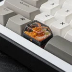 Fiery Charizard Keycap from a dynamic side angle, highlighting its vibrant orange and red scales, ready to unleash gaming nostalgia and elevate your setup now.