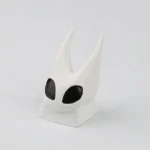 This artisan Hollow Knight Hornet resin keycap, meticulously handcrafted, is shown from different angles, highlighting its intricate dark fantasy.