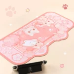 An artistic view of the Cherry Blossom Cat Desk Mat & Mouse Pad, highlighting its delicate pink flowers and adorable cat illustrations. Enjoy the aesthetic comfort.