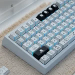 Playful Chiikawa Joke Bear PBT keycap set. Features side-engraved legends and angular shadow effects, with close-up details.