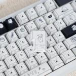 Whimsical Chiikawa Joke Bear PBT keycap set, highlighting unique side-engraved legends and playful angular shadow effects.