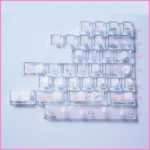 Explore different angles of the playful Chiikawa Joke Bear PBT side-print backlit keycap set, highlighting its charming cartoon design and translucent design.