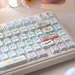 Adorable Chiikawa UR82 tri-mode mechanical keyboard, showcasing its compact design, playful pastel keycaps, and charming character silhouettes.