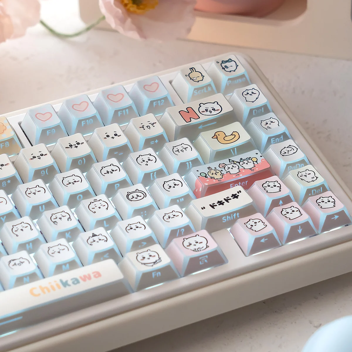 Adorable Chiikawa UR82 tri-mode mechanical keyboard, showcasing its compact design, playful pastel keycaps, and charming character silhouettes.