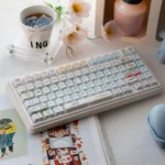 Adorable Chiikawa UR82 tri-mode mechanical keyboard, showcasing its charming pastel keycaps and compact layout from an elevated angle.