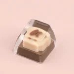 A delightful handcrafted chocolate slice bread dessert keycap for ESC, showcasing its whimsical miniature art from multiple angles with delightful resin keycap.