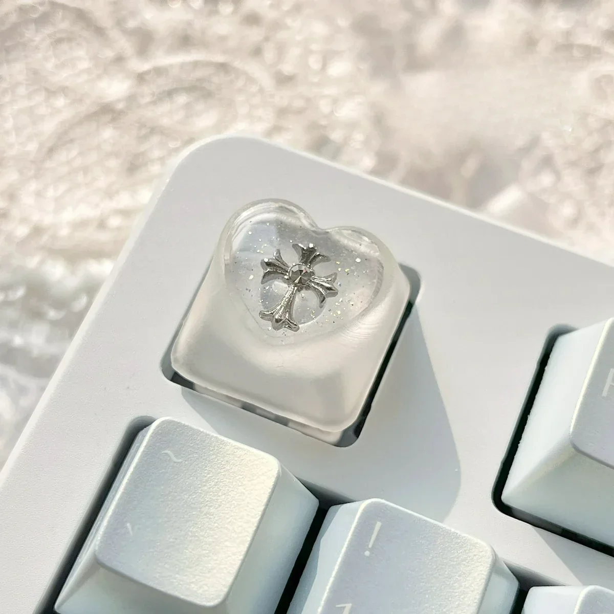 Chrome Hearts Keycap gallery, showing iconic gothic cross and heart designs. Mysterious foggy transparency and edgy monochromatic artisan finish.