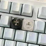 Premium Chrome Hearts Keycap, featuring the iconic gothic cross and heart design through a mysterious foggy transparent finish. Captures an edgy.
