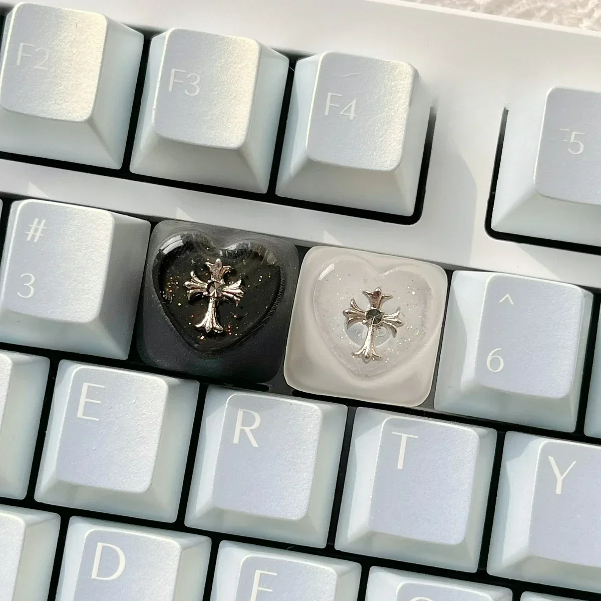 Premium Chrome Hearts Keycap, featuring the iconic gothic cross and heart design through a mysterious foggy transparent finish. Captures an edgy.