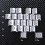 Close-up of 21 iconic Chrome Hearts gothic heart Supplement Keycap Set in sleek silver, featuring a blank, unetched design for an edgy PC setup.