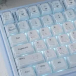 Close-up of adorable Cinnamoroll crystal jelly keycaps, showcasing their whimsical translucent pastel design and sparkling, crystal-like finish.