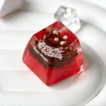 Iconic Coca-Cola retro resin ESC keycap from multiple artistic angles, emphasizing its vibrant branding, glossy finish, and handcrafted design.