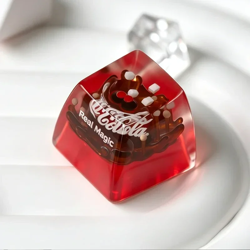 Iconic Coca-Cola retro resin ESC keycap from multiple artistic angles, emphasizing its vibrant branding, glossy finish, and handcrafted design.