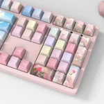 Vibrant PBT dye-sublimated rose keycaps set displayed from multiple artistic angles, revealing intricate patterns and rich, lasting colors of the elegant design.