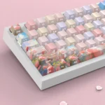 A close-up view of vibrant PBT dye-sublimated rose keycaps set, showcasing intricate floral details and rich colors from multiple artistic angles.