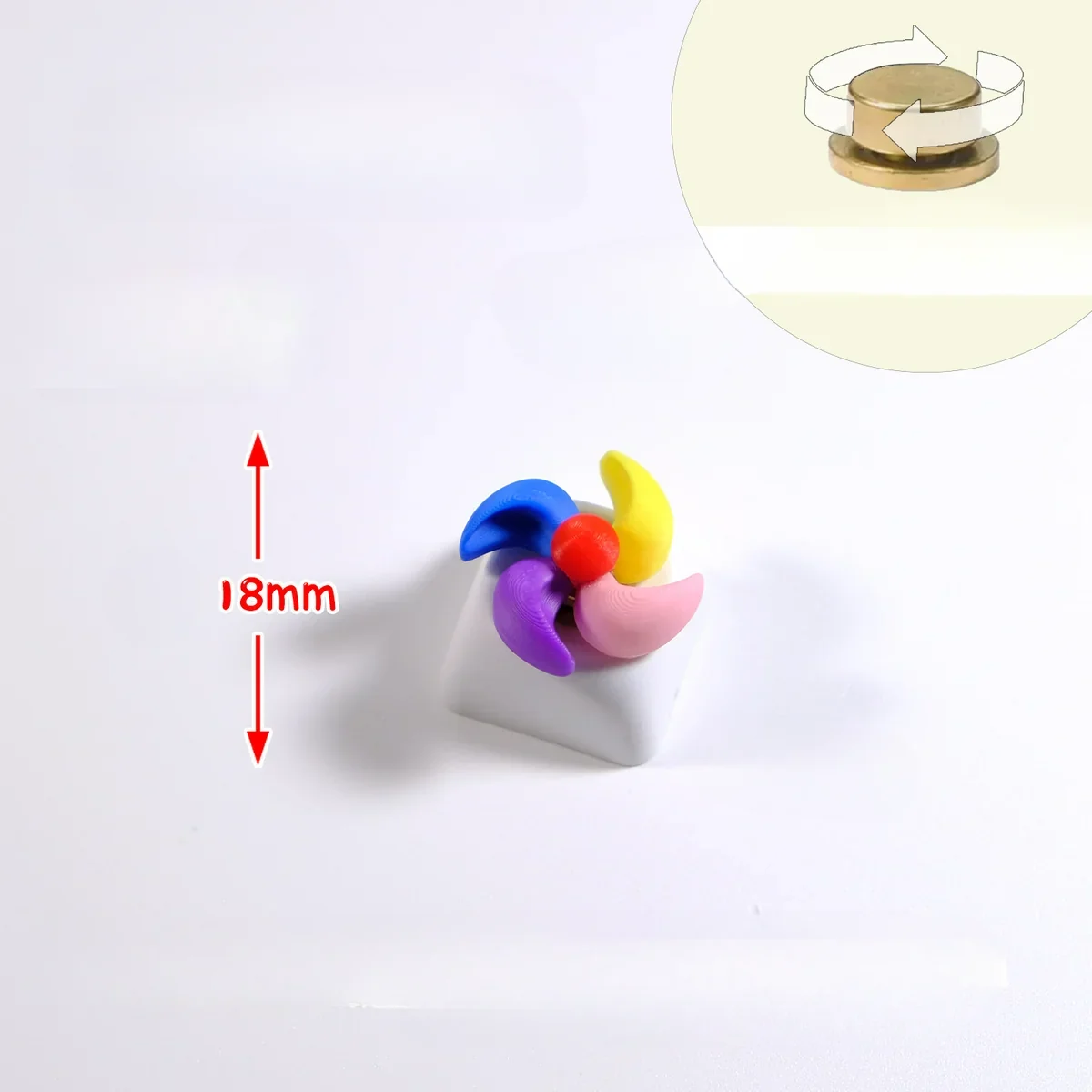 Handcrafted rotating colorful spinning windmill keycap, seen from a new angle, accentuating its vibrant miniature design and dynamic blades.