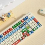 Whimsical Cow Ranch PBT keycaps set, shown in multiple views, featuring playful cow prints and rustic farm details. Durable PBT, crisp dye-sub.