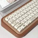 Cozy Chocolate PBT Keycaps Set, displayed from a playful, inviting angle, highlighting their warm hues and unique crisp, dessert-like design.