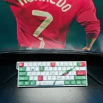 Vibrant Cristiano Ronaldo Portugal PBT keycap set gallery, displaying dynamic CR7 iconography and patriotic team colors from multiple angles. Exclusive design.