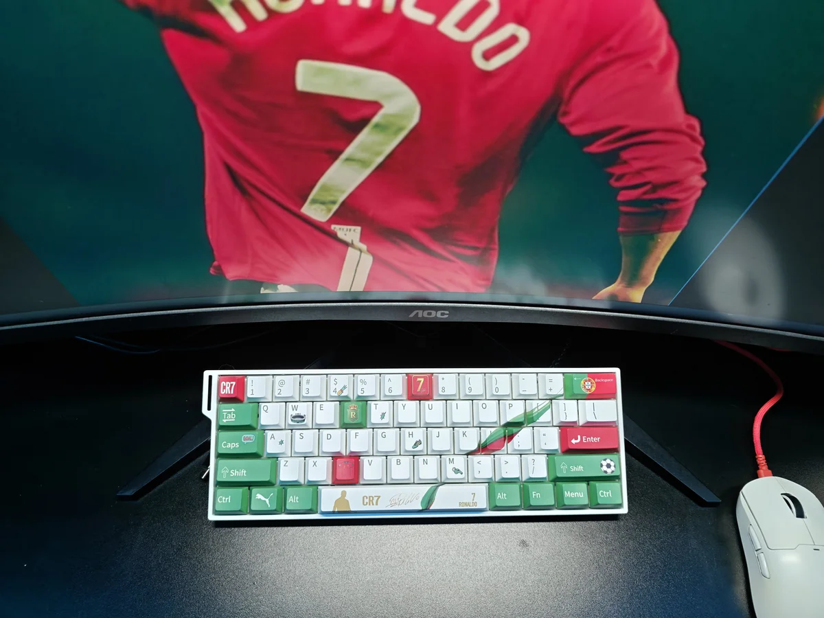 Vibrant Cristiano Ronaldo Portugal PBT keycap set gallery, displaying dynamic CR7 iconography and patriotic team colors from multiple angles. Exclusive design.