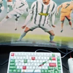 Vibrant Cristiano Ronaldo Portugal PBT keycap set, showcasing dynamic CR7 iconography and patriotic colors. Exclusive premium keycaps for fans.