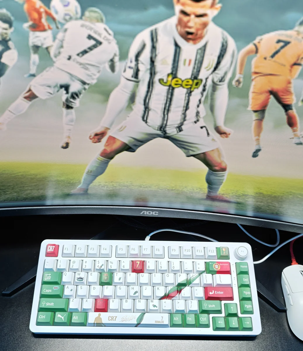 Vibrant Cristiano Ronaldo Portugal PBT keycap set, showcasing dynamic CR7 iconography and patriotic colors. Exclusive premium keycaps for fans.